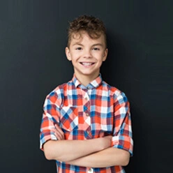 a boy smiling on a nutrition awareness programme